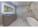 Spa-like bathroom with double vanity, walk-in shower, and freestanding tub at 2036 E Camellia Dr, Decatur, GA 30032