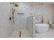 Modern bathroom with walk-in shower, marble tile, and gold fixtures at 2036 E Camellia Dr, Decatur, GA 30032