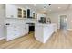 Modern kitchen with white cabinets, island, and stainless steel appliances at 2036 E Camellia Dr, Decatur, GA 30032