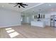 Open living room with hardwood floors and ceiling fan at 2036 E Camellia Dr, Decatur, GA 30032