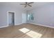 Main bedroom with hardwood floors and access to the bathroom at 2036 E Camellia Dr, Decatur, GA 30032