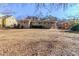 Spacious backyard offering a view of the house and surrounding landscape at 3205 Harris Dr, Atlanta, GA 30344