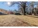 Private backyard with large tree providing shade and a peaceful atmosphere at 3205 Harris Dr, Atlanta, GA 30344