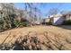 Large backyard with mature trees and ample space for outdoor activities at 3205 Harris Dr, Atlanta, GA 30344