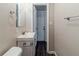 Clean bathroom with vanity, toilet, and access to hallway at 3205 Harris Dr, Atlanta, GA 30344