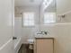 Updated bathroom with granite vanity and tiled walls at 3205 Harris Dr, Atlanta, GA 30344