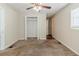 Bedroom with ceiling fan, carpet, and built-in closet at 3205 Harris Dr, Atlanta, GA 30344