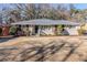 Brick ranch home with a spacious lawn and mature trees at 3205 Harris Dr, Atlanta, GA 30344