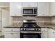 Gas range, microwave, and granite countertop at 3205 Harris Dr, Atlanta, GA 30344