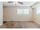 Living room with wall paneling, ceiling fan, and carpet at 3205 Harris Dr, Atlanta, GA 30344