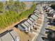 Aerial view showing townhouses nestled amongst lush greenery at 646 Oakside Pl, Acworth, GA 30102