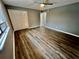 Spacious bedroom with ceiling fan, window coverings, and wood-look flooring at 1608 Briarcliff Ne Rd # 3, Atlanta, GA 30306