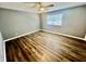 Bright bedroom with ceiling fan, window coverings, and wood-look flooring at 1608 Briarcliff Ne Rd # 3, Atlanta, GA 30306