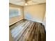 Well-lit bedroom featuring a window with blinds and wood-look flooring at 1608 Briarcliff Ne Rd # 3, Atlanta, GA 30306