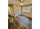 Bedroom with built-in shelving, window, and ceiling fan at 1608 Briarcliff Ne Rd # 3, Atlanta, GA 30306