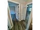 Hallway with doors to bedrooms and linen closet, featuring wood-look flooring at 1608 Briarcliff Ne Rd # 3, Atlanta, GA 30306
