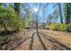 Spacious backyard with mature trees and a large grassy area at 3388 Jackson Dr, Decatur, GA 30032
