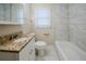 Updated bathroom, granite vanity, and marble tile shower/tub at 3388 Jackson Dr, Decatur, GA 30032