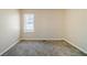 Simple bedroom with neutral walls and carpet flooring at 3388 Jackson Dr, Decatur, GA 30032
