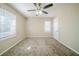 Bright bedroom with ceiling fan and neutral carpeting at 3388 Jackson Dr, Decatur, GA 30032