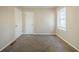 Spacious bedroom with neutral walls and carpet flooring at 3388 Jackson Dr, Decatur, GA 30032