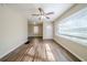 Bright living room, hardwood floors, and ceiling fan at 3388 Jackson Dr, Decatur, GA 30032
