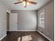 Bedroom with hardwood floors, ceiling fan and window at 1395 W Austin Rd, Decatur, GA 30032