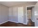 Spacious bedroom with hardwood floors and an interior door at 1395 W Austin Rd, Decatur, GA 30032