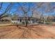 Gray house with carport and fenced yard at 1395 W Austin Rd, Decatur, GA 30032