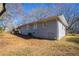 Side view of a gray brick ranch house at 1395 W Austin Rd, Decatur, GA 30032