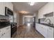 Updated kitchen with white cabinets at 1395 W Austin Rd, Decatur, GA 30032