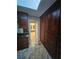 Primary bathroom with dark wood cabinetry, granite counters, and walk-in shower at 190 Valley Cv, Atlanta, GA 30350