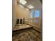 Bathroom featuring a jacuzzi tub and large windows at 190 Valley Cv, Atlanta, GA 30350