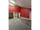 Spacious bedroom with red walls and ceiling fan at 190 Valley Cv, Atlanta, GA 30350