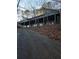 House on a hill with long driveway, surrounded by trees and foliage at 190 Valley Cv, Atlanta, GA 30350