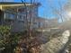 House exterior showcases a unique design, wood deck, and stone pathway at 190 Valley Cv, Atlanta, GA 30350