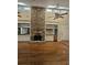 Spacious great room features a stone fireplace, hardwood floors, and abundant natural light at 190 Valley Cv, Atlanta, GA 30350