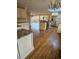 Open kitchen with island, stainless steel appliances, and hardwood floors at 190 Valley Cv, Atlanta, GA 30350
