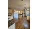 Open kitchen with island, stainless steel appliances, and hardwood floors at 190 Valley Cv, Atlanta, GA 30350