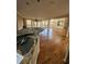 Island kitchen with granite countertops and hardwood floors at 190 Valley Cv, Atlanta, GA 30350