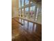 Living area with hardwood floors and wall of windows overlooking nature at 190 Valley Cv, Atlanta, GA 30350