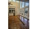 Living area with hardwood floors and wall of windows overlooking nature at 190 Valley Cv, Atlanta, GA 30350