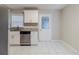 Updated kitchen with white cabinets, granite counters, and a view to the backyard at 2446 Lynn Iris Dr, Decatur, GA 30032