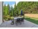 Private backyard with patio and lush greenery at 334 Spotted Ridge Cir, Woodstock, GA 30188