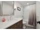 Updated bathroom features a white vanity, modern fixtures, tiled walls, and a shower-tub combo at 334 Spotted Ridge Cir, Woodstock, GA 30188