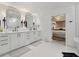 This bathroom features dual sinks, sconces and access to the main bedroom at 334 Spotted Ridge Cir, Woodstock, GA 30188