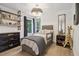 Cozy bedroom with a playful bookshelf, stylish dresser, and a comfortable bed at 334 Spotted Ridge Cir, Woodstock, GA 30188