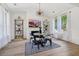 Dining area with modern chandelier, built in shelves, and mountain artwork at 334 Spotted Ridge Cir, Woodstock, GA 30188