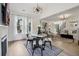 Charming dining area features a round table, four chairs, and a modern chandelier at 334 Spotted Ridge Cir, Woodstock, GA 30188