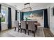 Formal dining room with scenic mural and modern chandelier at 334 Spotted Ridge Cir, Woodstock, GA 30188